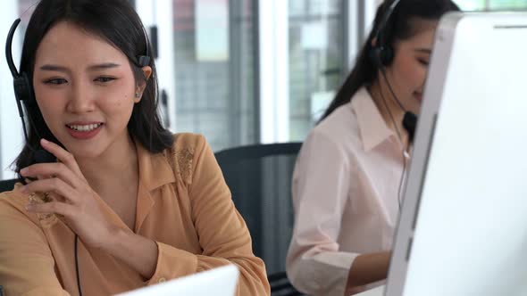 Business People Wearing Headset Working Actively in Office