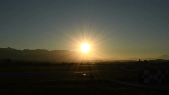 Airplane Arriving to Airport at Sunset