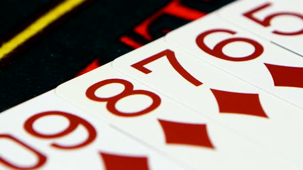 Two Suits of Cards on Green Cloth Casino Table, Closeup