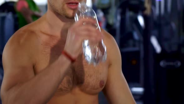 Man Drink Water at the Gym