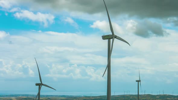 Modern Wind Turbines Rotating in Stormy Weather. New Alternative Energy Source