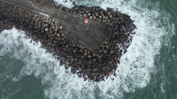 Storm Waves Crashing To the Pier Rocks in Dark Windy Evening