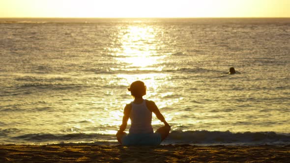 Back View of Unrecognizable Slender Young Yoga Woman Sitting in Lotus Position