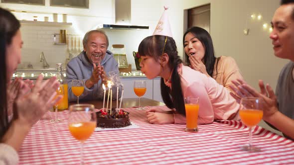 Happy family, Asian big family having small party eating food on dining table together at home.