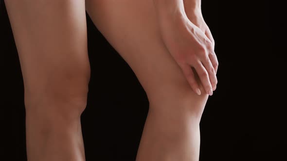Woman Massaging Her Painful Knee
