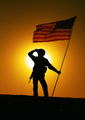 US soldier with flag looking far away at sunset - PhotoDune Item for Sale