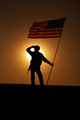 US soldier with flag looking far away at sunset - PhotoDune Item for Sale