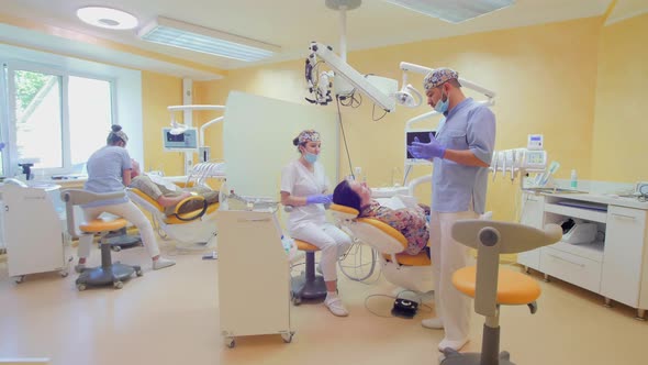 Dentist talking with a patient