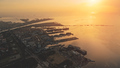 Sunset over pier town at ocean bay aerial. Amazing sun set light at marina seascape. Ships, yachts - PhotoDune Item for Sale