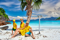 Family with three year old boy on beach. Seychelles, Mahe. - PhotoDune Item for Sale