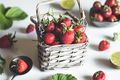 fresh strawberries in a basket on a white wooden table - PhotoDune Item for Sale