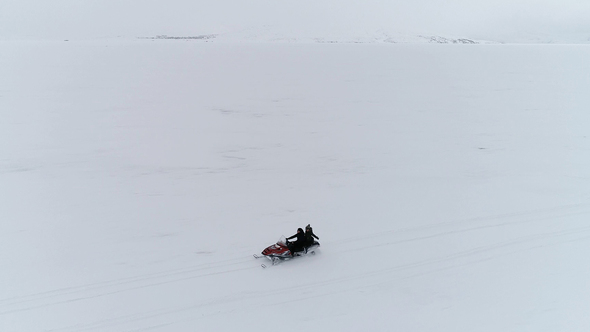 Snowmobile Tour on a Frozen Lake