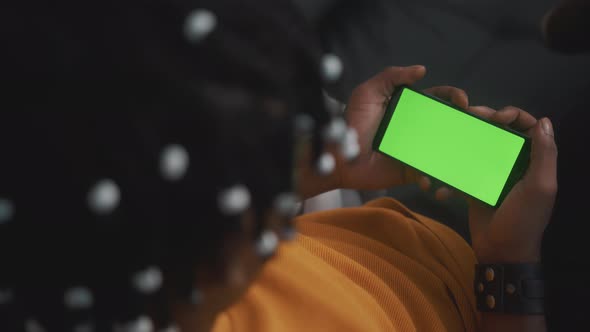 African American Black Man Holding Smartphone with Green Screen