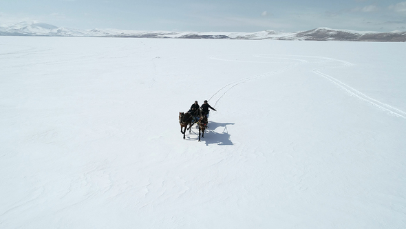 Sleighs Running on Frozen Lake