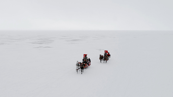 Sleds Running Over the Frozen Lake