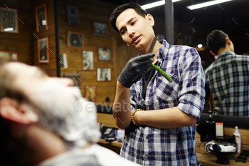 ne of clients in his own barbershop