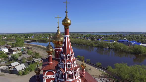 Beautiful Church By the River at Sunset on the Background of the Flooded City