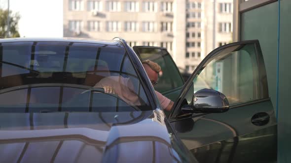 Front View Car with Confident Caucasian Tattooed Father and Son Walking Out in Slow Motion