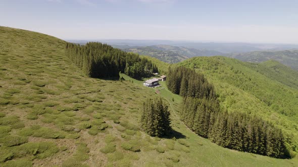 Aerial View of Ambaritsa Hut Situated on the Slope with View of the Valley Below