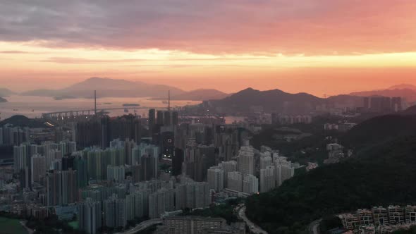 Aerial shot of city view of Kowloon Hong Kong during sunset time. Hong Kong skyline day time at Vict