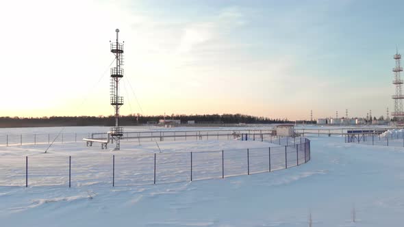 A Drone Flies Over an Emergency Gas Release Tower at an Oil and Gas Extraction and Treatment