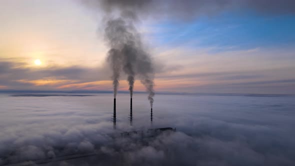 Coal Power Plant High Pipes with Black Smoke Moving Upwards Polluting Atmosphere