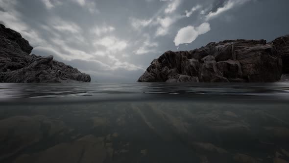 Half Underwater in Northern Sea with Rocks