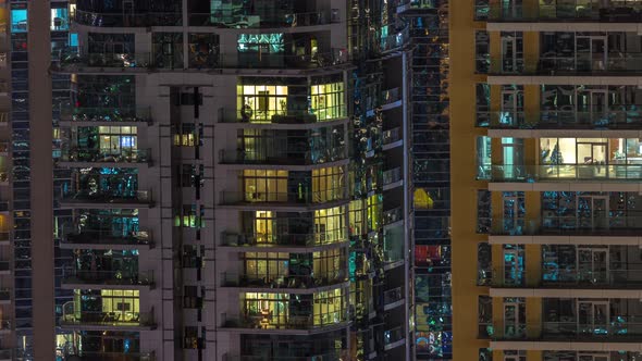 Windows in Highrise Building Exterior in the Late Evening with Interior Lights on Timelapse