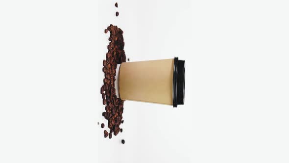 Vertical Shot of Coffee To Go Cup and Beans Isolated