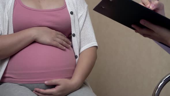 Pregnant Woman and Gynecologist Doctor at Hospital