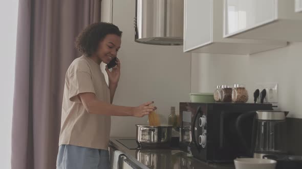 Biracial Girl Cooking Spaghetti