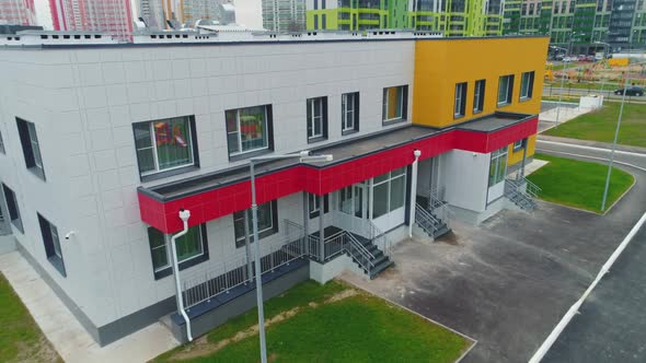 Entrance to Modern Kindergarten Building in City Block