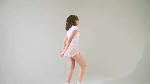 Girl with Curly Hair Dancing