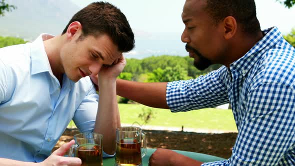 Male friends interacting each other in outdoor restaurant 4k