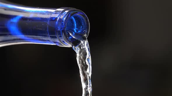 Water Pouring From a glass Bottle