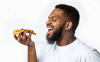 ing Over White Studio Background. Junk Food Eater’s Portrait. Unhealthy Nutrition And Binge Eating Habit. Pizza Delivery Concept