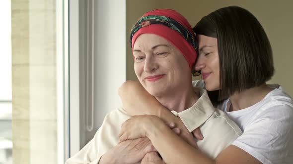 Young Woman Hugs Her Sick Mom After Chemotherapy