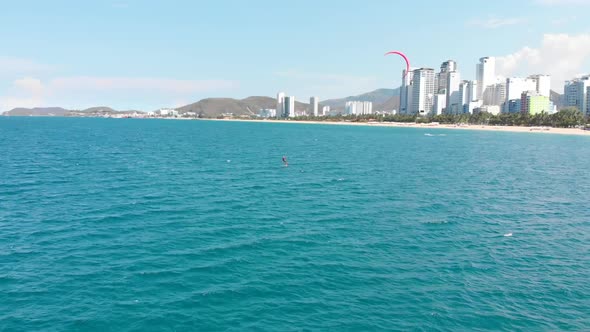 Extreme Water Sport and Summer Vacations Concept. Professional Kite Surfer on the Sea Wave, Athlete