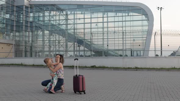 Mother Meet Her Daughter Child Near Airport Terminal with Open Arms After Long Flight Vacations Work