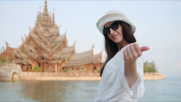 Young Woman Touirist Smiling and Posing in Front of the Ancient Temple