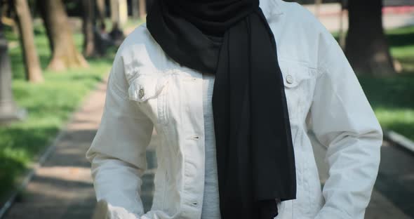 Woman Wearing Hijab Standing in Morning Street