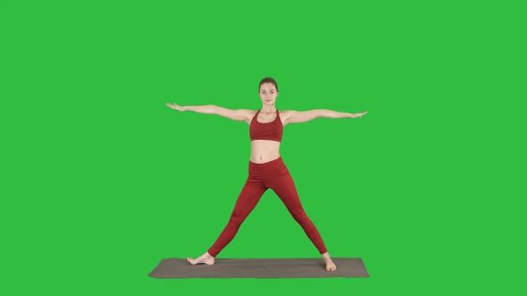 Woman practicing yoga standing in Extended Side Angle