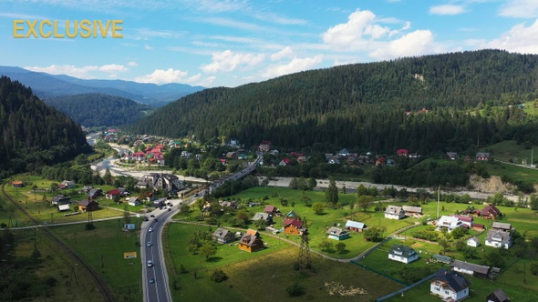 Carpathian Mountains with River and Beautiful Road