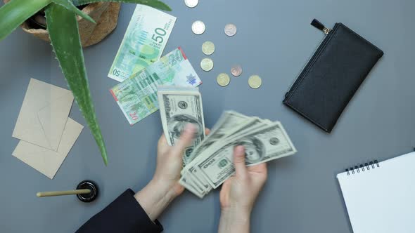 Accountant counting hundred dollars banknotes money