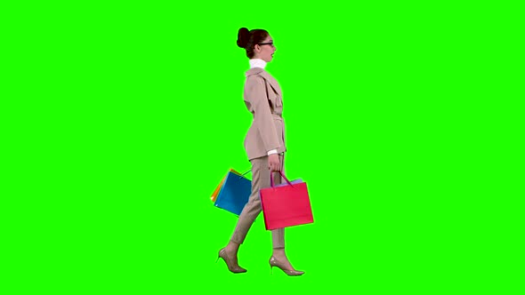 Girl Goes Shopping in the Store. Green Screen. Slow Motion