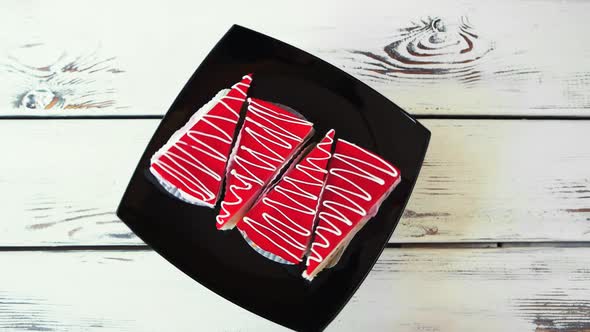Slices of Red Cakes on Black Plate