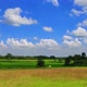 Landscape Autumn Sky with deep blue sky and white clouds hovering over the line green ground. - VideoHive Item for Sale