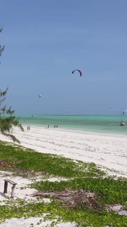 Tanzania  Vertical Video Kitesurfing Near the Shore of Zanzibar Slow Motion