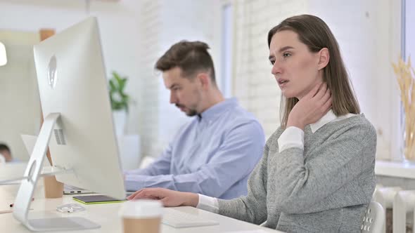 Creative Woman Working on Desktop and Having Neck Pain