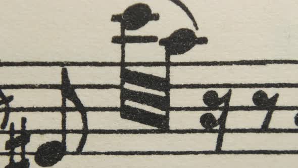 Musical background, sheet music. Stop motion